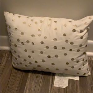Gold and white throw pillow